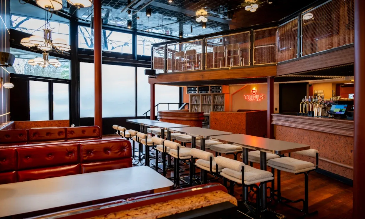 The bar, featuring booths, bar-style seating and an upstairs section.