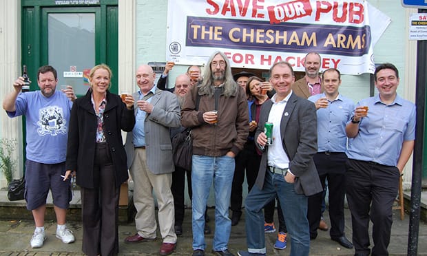 Mine's a pint: Victorious Chesham Arms campaigners. Photograph: Save the Chesham