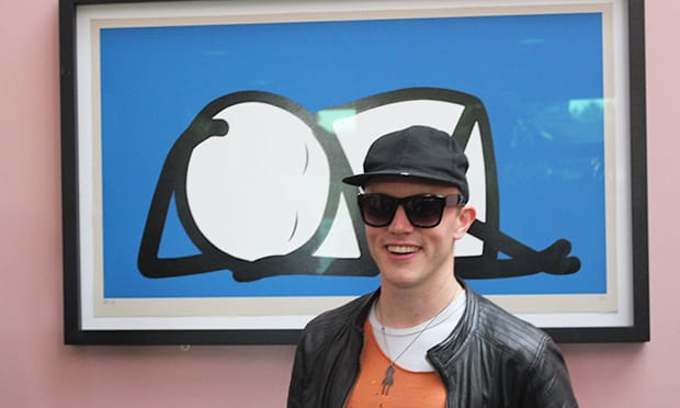 Stik infront of a print of Sleeping Baby. Photograph: Russell Parton